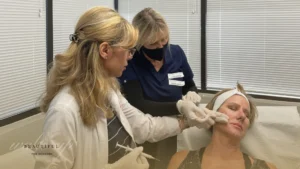 aesthetic injector training session in California with licensed clinician supervising facial injection procedure